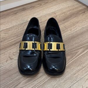 Elegant Prada Black Loafers with Gold Accent 🖤